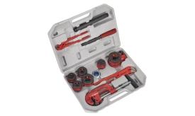 Comprehensive pipe threading tool set featuring various sizes of dies and wrenches in a protective case for plumbing tasks.