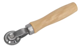 Wooden handle pastry cutter tool with a round blade for cutting dough, ideal for baking and pastry preparation.